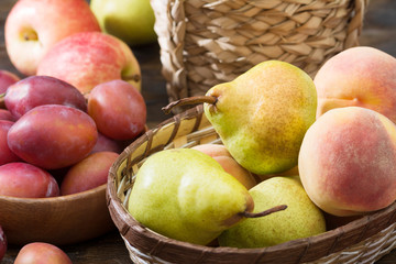 Fruit in baskets on a wooden table. Harvest