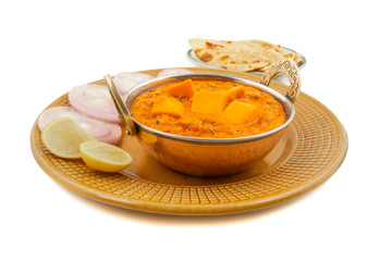 Indian Popular Vegetarian Cuisine Cheese Butter Masala Also Know as Cheese Cottage Curry or Paneer Butter Masala Served With Tandoori Roti on Isolated White Background