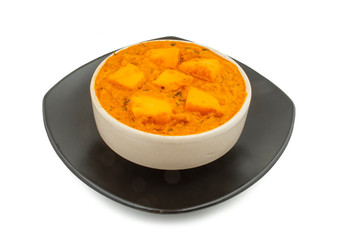 Indian Popular Vegetarian Cuisine Cheese Butter Masala Also Know as Cheese Cottage Curry or Paneer Butter Masala on Isolated White Background