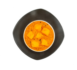 Indian Popular Vegetarian Cuisine Cheese Butter Masala Also Know as Cheese Cottage Curry or Paneer Butter Masala on Isolated White Background