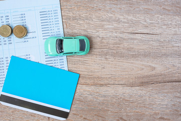 Book bank with Car on wood table background with copy space. financial, money, refinance, Car for cash and Car insurance concept