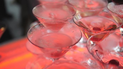 Close-up of the seething dry folk in champagne glasses on a buffet table in slow motion.