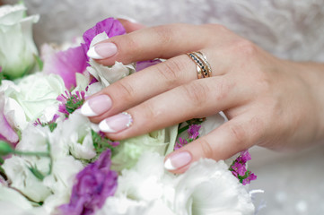Fototapeta premium Beautiful wedding bouquet in hands of the bride