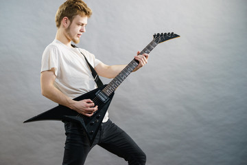 Man playing on electric guitar