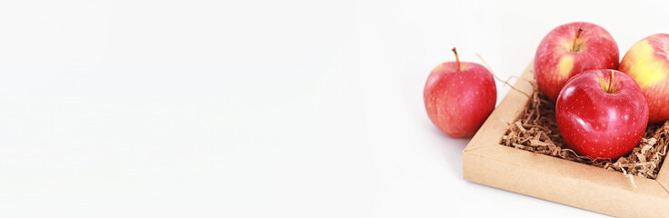 Fresh juicy apples on a white table