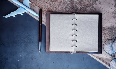 Travel concept. Map on the table andl aircraft.