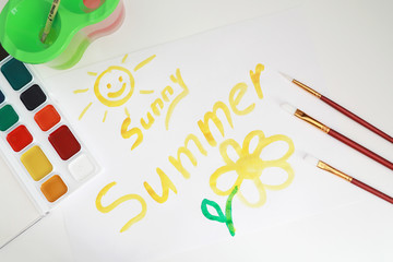 Drawing paints on a white sheet of paper