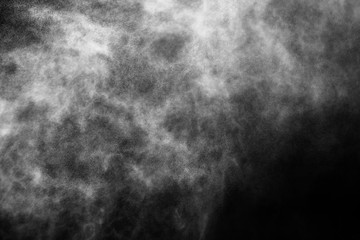 A stream of water and a cloud of drops