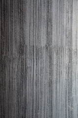 Texture background of dark gray stucco linear pattern on wall