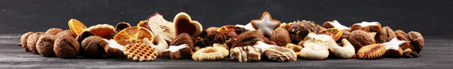 Decoration with christmas cookies. Typical cinnamon stars with fruits and nuts cinnamon