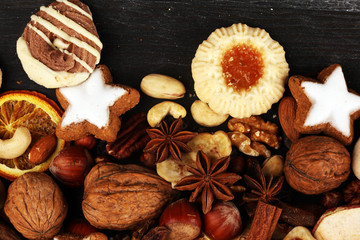 Decoration with christmas cookies. Typical cinnamon stars with fruits and nuts cinnamon