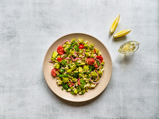 Fresh vegetable salad with cabbage romanesco and olive oil. Top view.