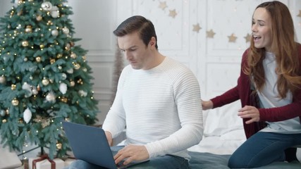 Handsome business man working laptop computer in luxury house.
