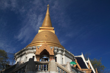 stupa at noon under blue sky Background