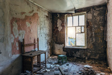 Interior of messy room at old abandoned building