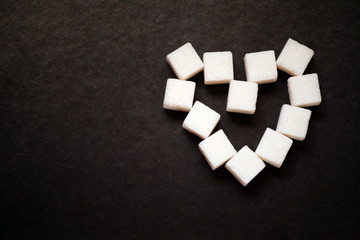 sugar heart symbol dark background 