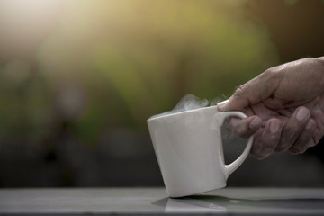white cup of coffee and smoke.
