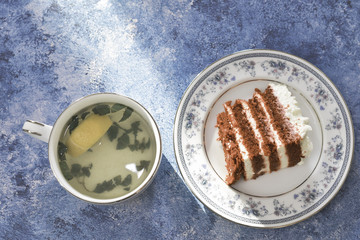 tea with cake on a blue background
