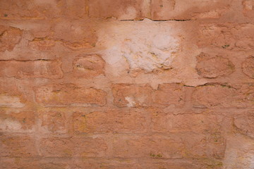 Detail of a wall of brown-colored tuff bricks