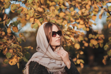 portrait fashion model woman with scarf on her head and sunglasses