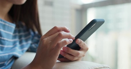 Woman use of mobile phone at home