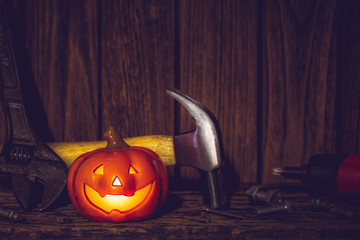 Happy Halloween day with construction tools and home DIY handy tools on rusty wooden background concept with copy space.
