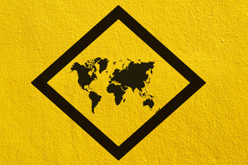 world map signs on yellow wall