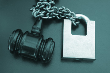 Non-independent justice concept with padlock and gavel