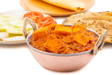 Indian Delicious Spicy Vegetarian Cuisine Paneer Toofani Also Know as Paneer Tufani, Toofani Paneer Masala or Dhaba Style Paneer Masala Served with Tandoori Roti on isolated White Background