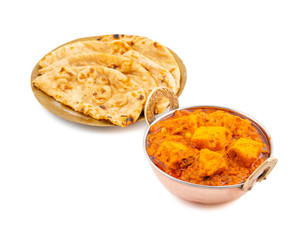 Indian Delicious Spicy Vegetarian Cuisine Paneer Toofani Also Know as Paneer Tufani, Toofani Paneer Masala or Dhaba Style Paneer Masala Served with Tandoori Roti on isolated White Background