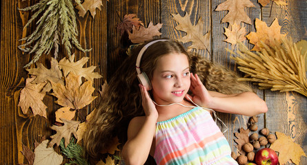 Music application for youth modern gadget. Child girl listen music headphones top view. Fall music...