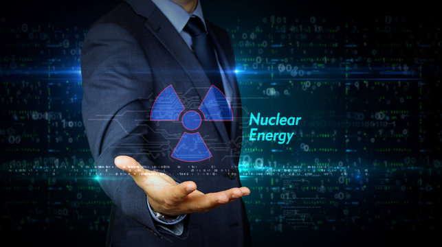 Businessman touch screen with nuclear energy symbol hologram - Powered by Adobe