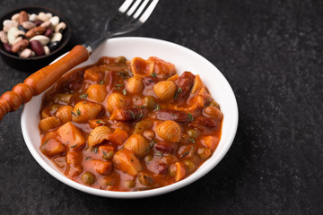 vegetable grains peas soup in tomato sauce