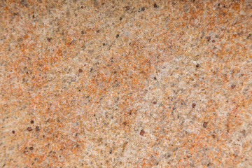 Flatlay of light orange granite surface of floor