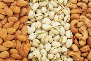 Nuts background, pistachio, almond and cashew nuts