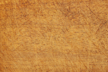 Old grunge wooden kitchen cutting board as background, chopping board close up