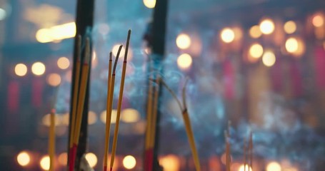 Incense sticks burning in chinese temple
