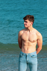 Shirtless on a beach