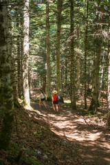 Fototapeta premium A woman hiking in the Aran valley in Spain, exactly in Artiga de Lin,