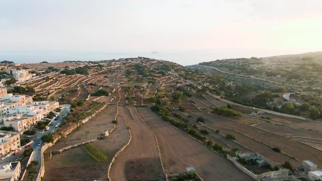 aerial drone shot over the agricultural terraced fields in Zurrieq, Malta, dolly in shot