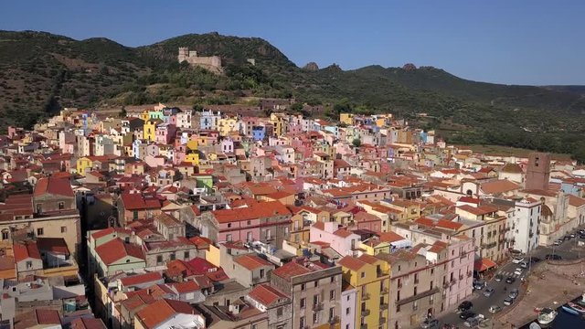 Bosa, Sardinia, Italy -Drone Aerial Shot over the colourful town of Bosa and its castle. A typical Italian and mediterranean landscape
