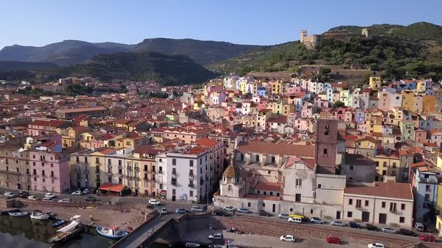 Bosa, Sardinia, Italy -Drone Aerial Shot over the colourful town of Bosa and its castle. A typical Italian and mediterranean landscape