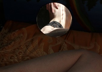 Mirror reflection of a girl in black underwear