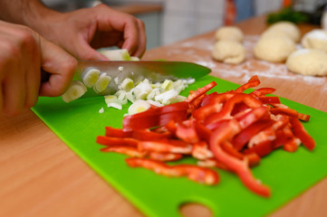 Man slicing vegetable
