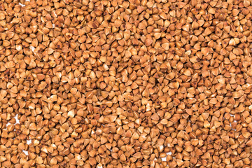 Macro Photo food buckwheat groats. Texture background grain buckwheat groats. Image food product porridge buckwheat grains