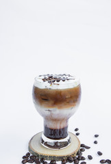 Cappuccino and coffee beans on a white background
