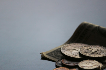 Shabby dollar bills and coins still life