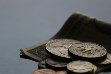 Shabby dollar bills and coins still life