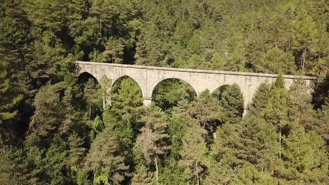 Aerial view of the Pont de la Frau aqueduct in Solsona, Catalonia, Spain, Europe.
Dolly shot flying towards the bridge.