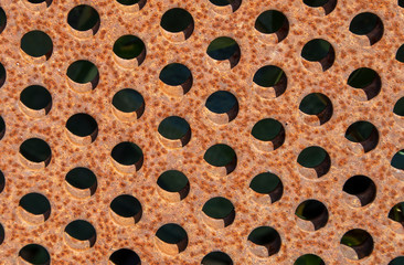 rusty metal plates with holes